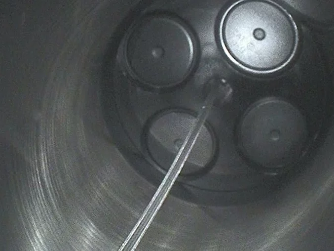 A borescopic inspection showing the internal components and early signs of wear in a CAT yacht engine.