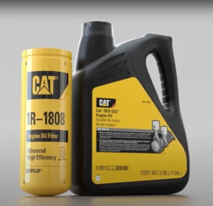 CAT engine oil filter next to a carton of CAT oil.