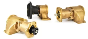 Three gold and black CAT marine engine pumps.