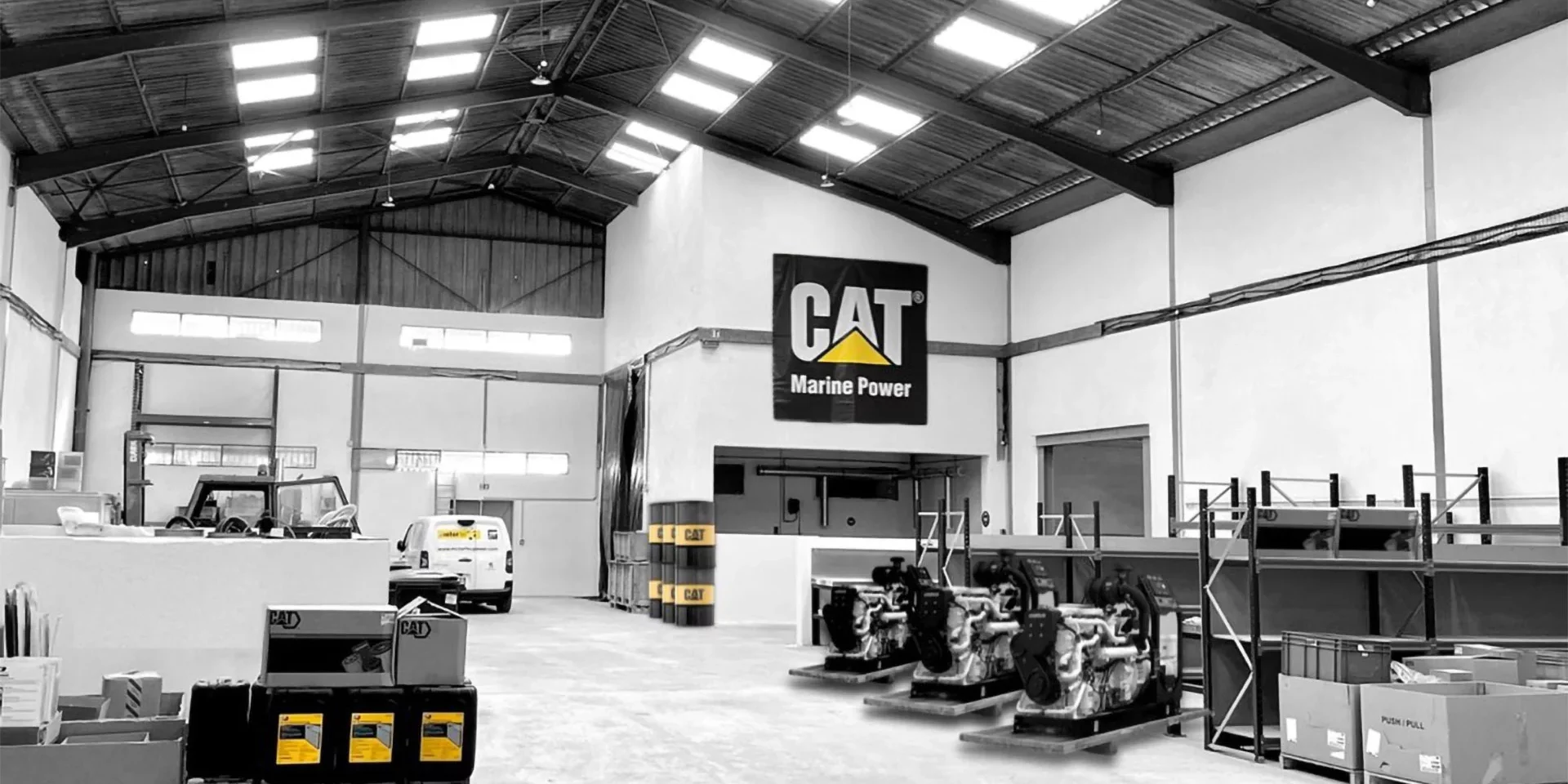 The Motortec CAT service centre in Cannes. Caterpillar logo depicted above the wall, and on parts around the centre.