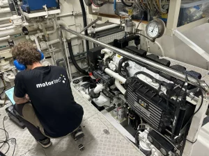 One of Motortec's expert technicians is working on Caterpillar engine repairs.