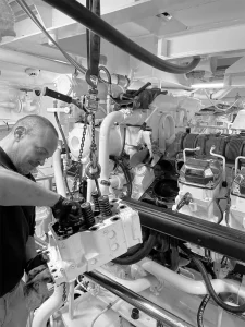Motortec team member working on Caterpillar marine power engine